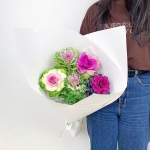 Ornamental kale wrapped white paper