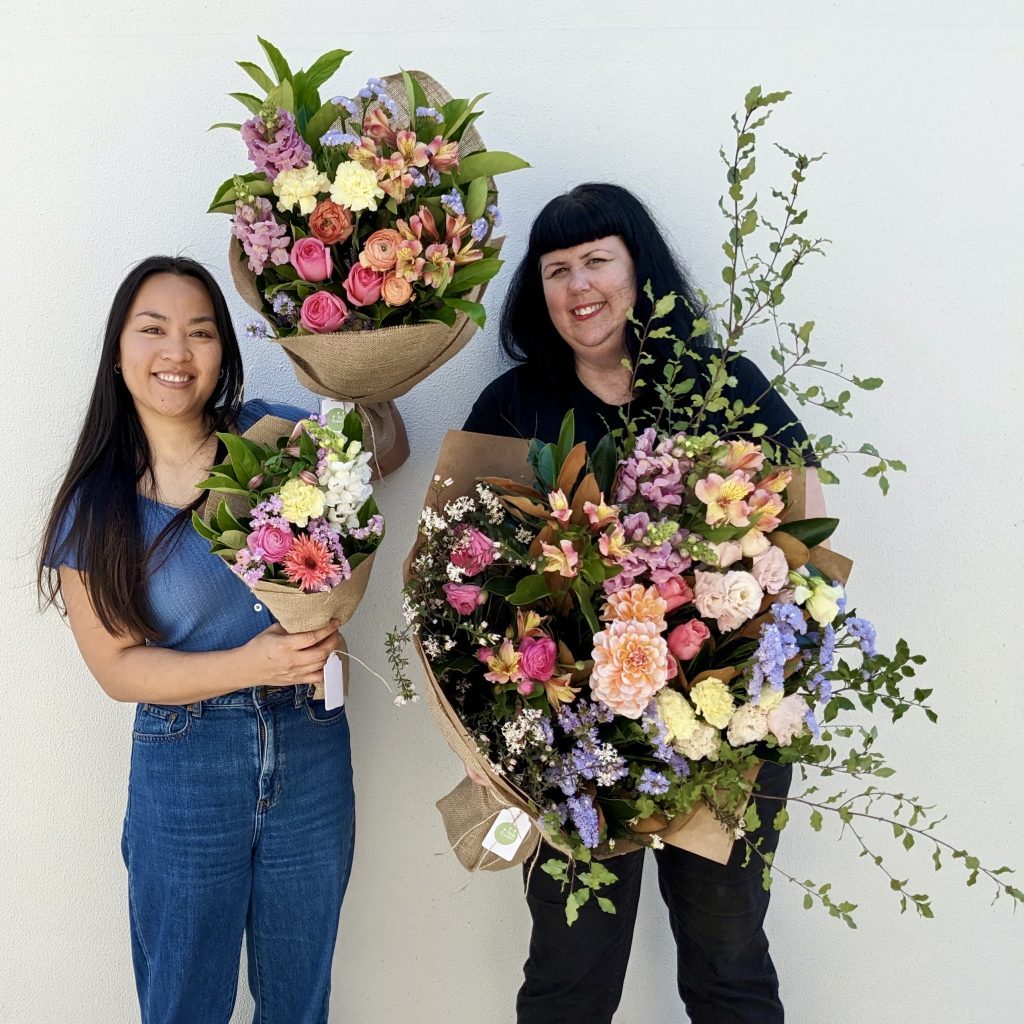 Two Sydney florists holding Little, Large and Luxe Daily Mixed Bouquets.