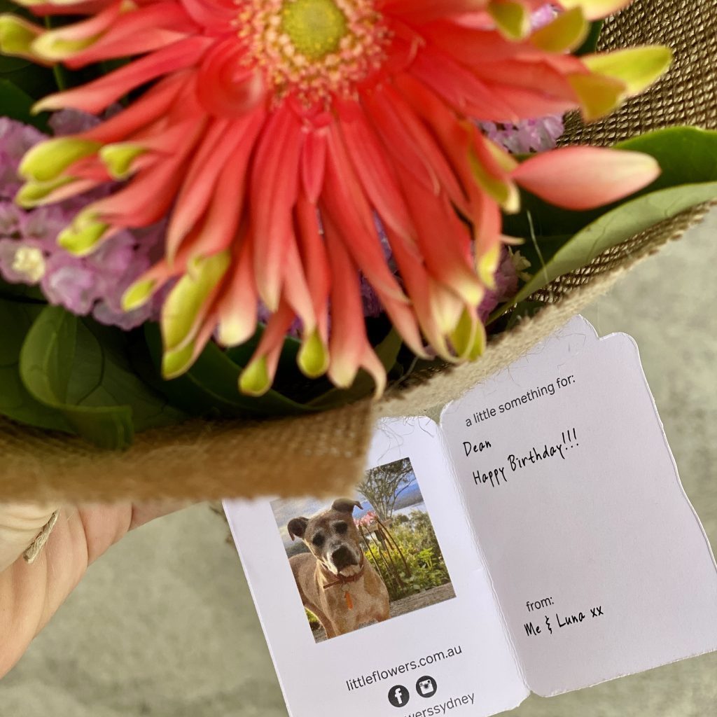 Birthday flower tag with photo of a dog, captioned ‘Happy Birthday!!! from me and Luna xx.