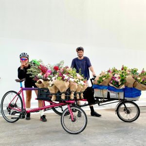 Little Flowers bike couriers delivering bouquets across Sydney