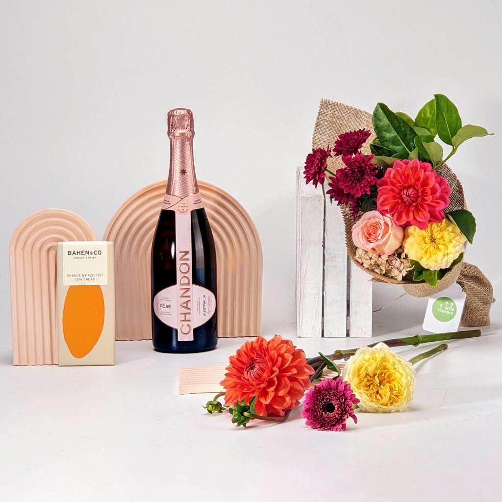 Flower bouquet paired with champagne.