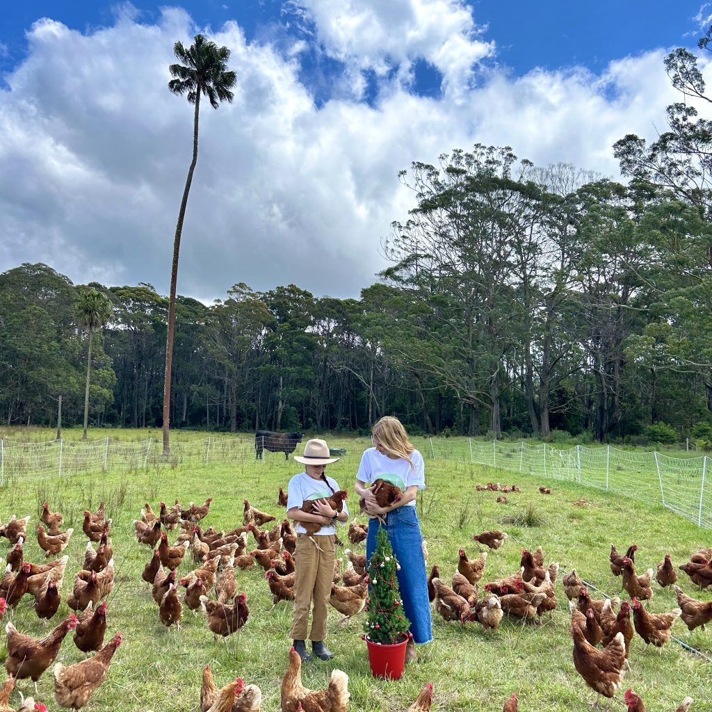 Family planting Little Flowers live Christmas tree at Jamberoo Mountain Farm