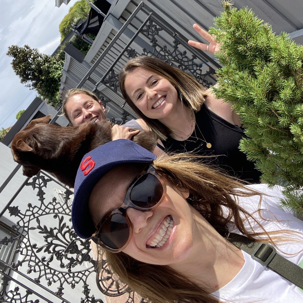 Little Flowers team collecting a Christmas tree from a Sydney household with the owners and their dog