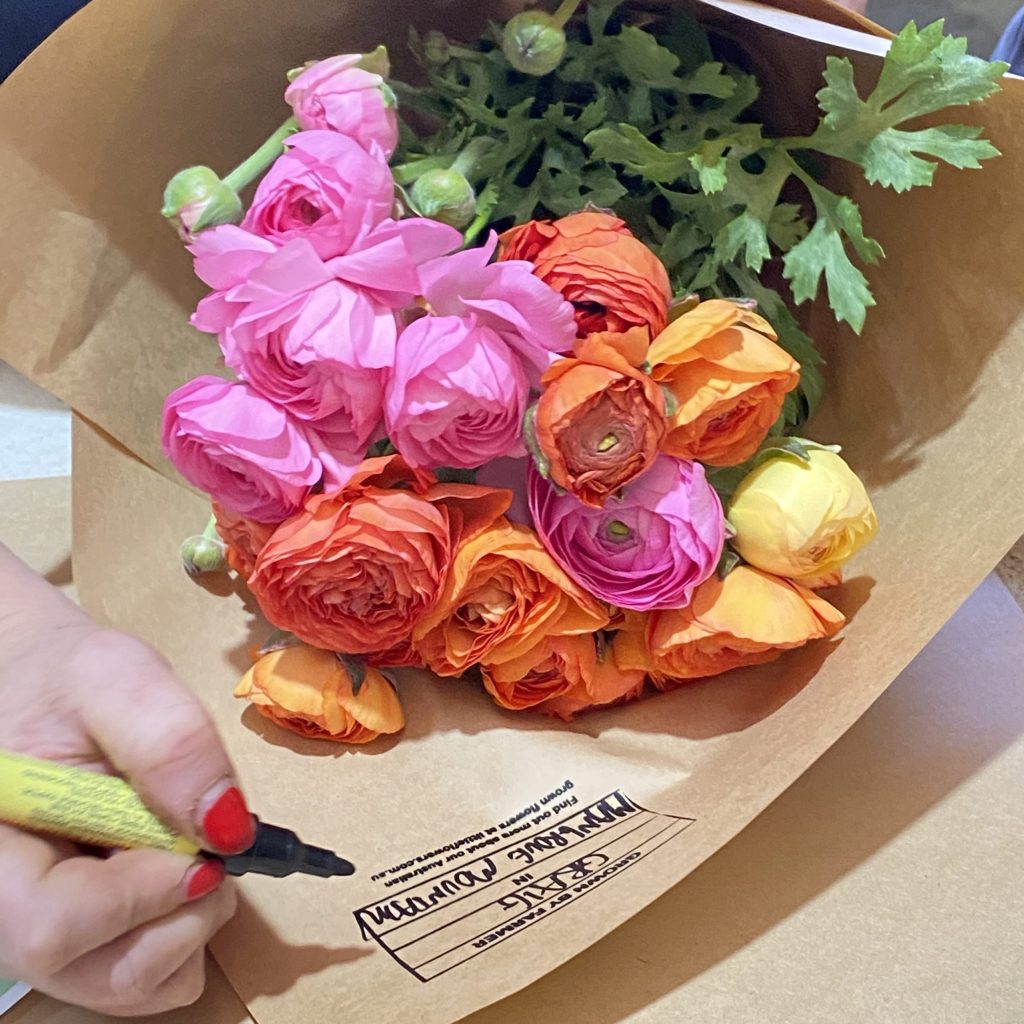 Self-gifted flowers with handwritten message tag in Sydney