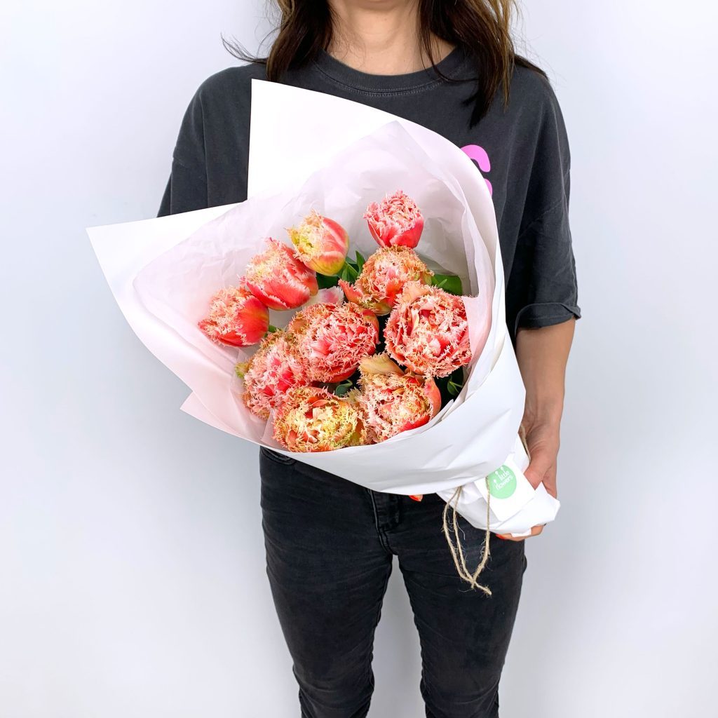Frilly parrot tulips with ruffled petals in a seasonal bunch